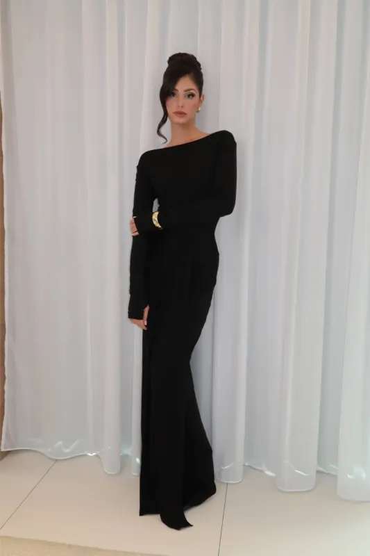 Black long sleeve twisted knit maxi dress sold by Heiress Beverly Hills