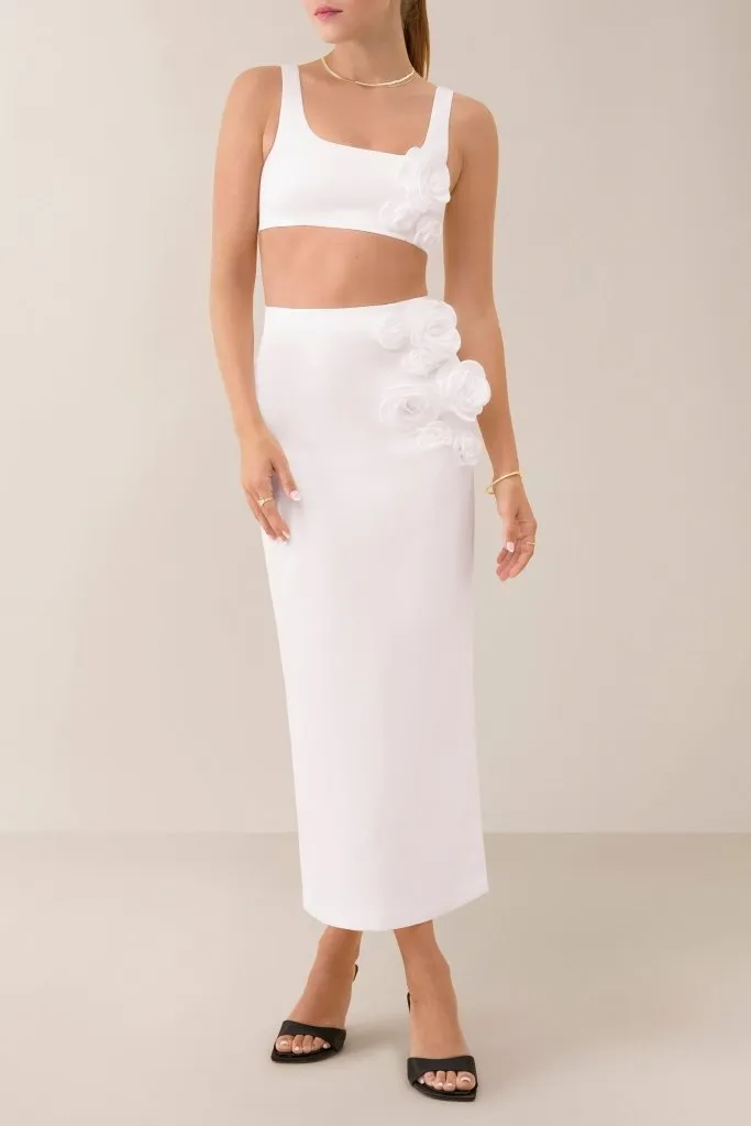 White flower embellished satin midi skirt sold by Heiress Beverly Hills