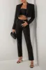 Black crepe tailored pants sold by Heiress Beverly Hills