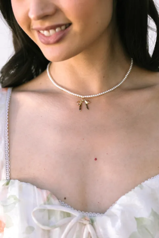 Natasha Pearl Necklace with Bow Charm sold by Morning Lavender