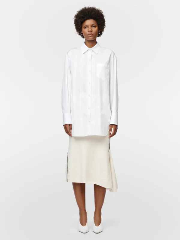 Asymmetric Fluted Skirt in Ivory sold by MARIA McMANUS