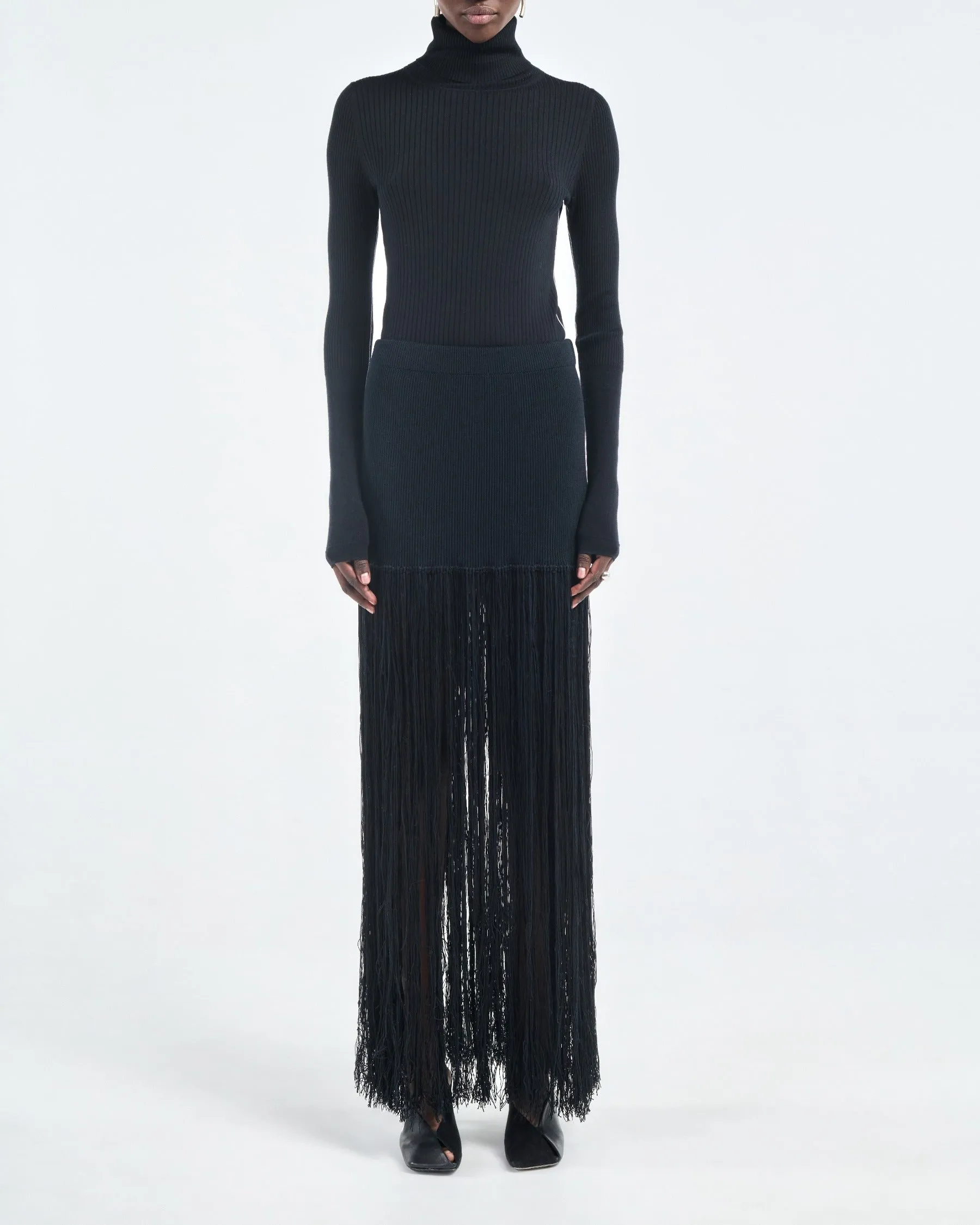 Ribbed Turtleneck in Black sold by MARIA McMANUS