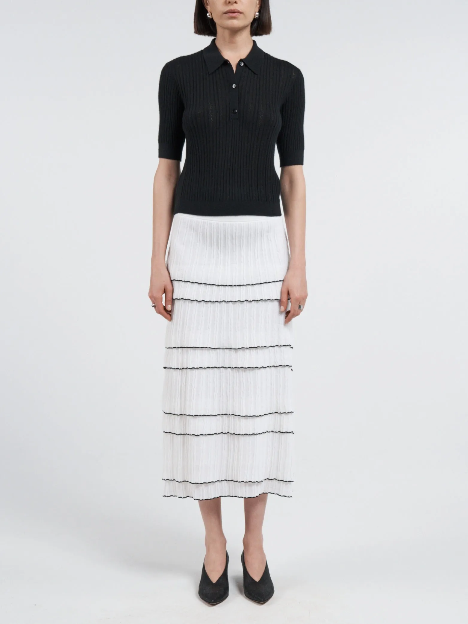 Pointelle Shrunken V Polo in Black sold by MARIA McMANUS