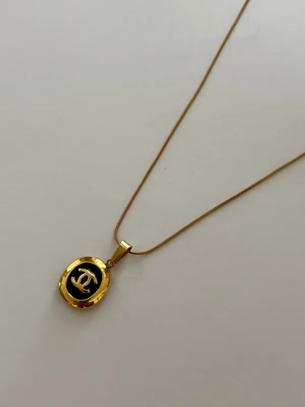 Chanel Charm Vintage Refurbished Designer Pendant Button necklace sold by Banks Jewelry