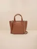 The Micro Expert Crossbody sold by BEE AND KIN