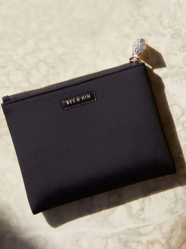 The Neoprene Zip Pouch sold by BEE AND KIN