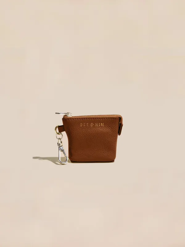The Mini Assistant AirPods Pouch sold by BEE AND KIN
