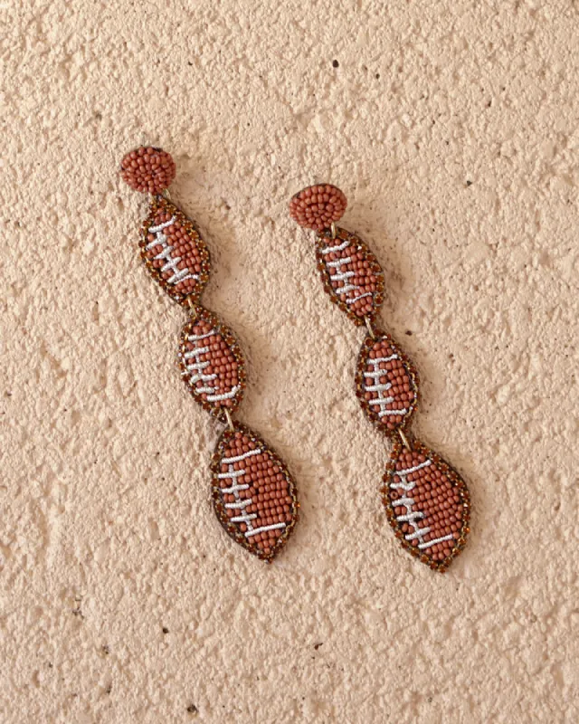 Football earrings sold by Care Tucker