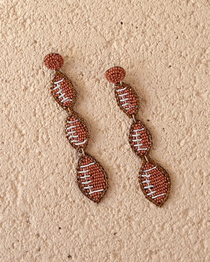 Football earrings sold by Care Tucker