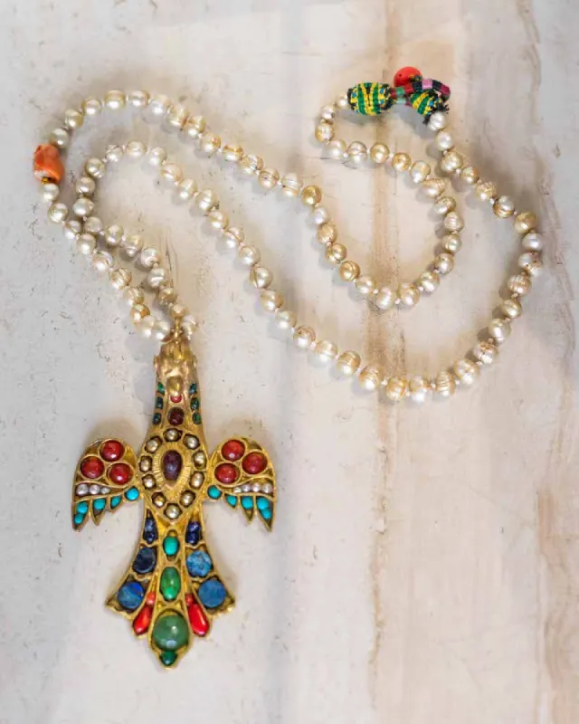 Santo Bird Pendant Necklace sold by Care Tucker