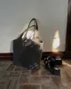 Maxi Quilted Denim Tote Bag sold by Care Tucker