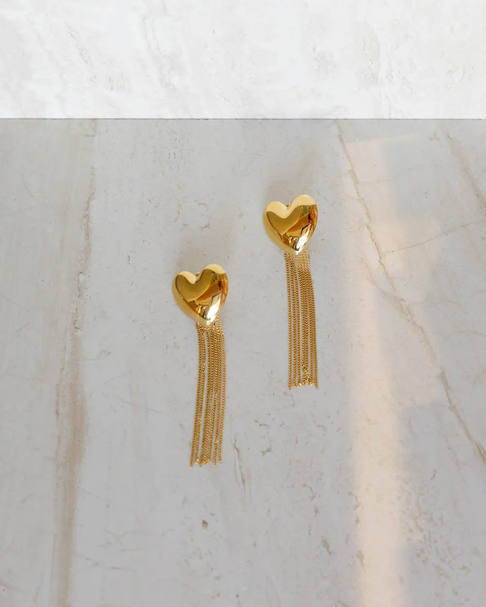Gold Heart Tassel Earrings sold by Care Tucker