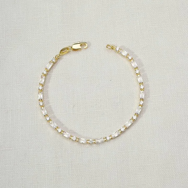 18k Gold Filled Baguette and Round Cut Cubic Zirconia Tennis Bracelet sold by Care Tucker