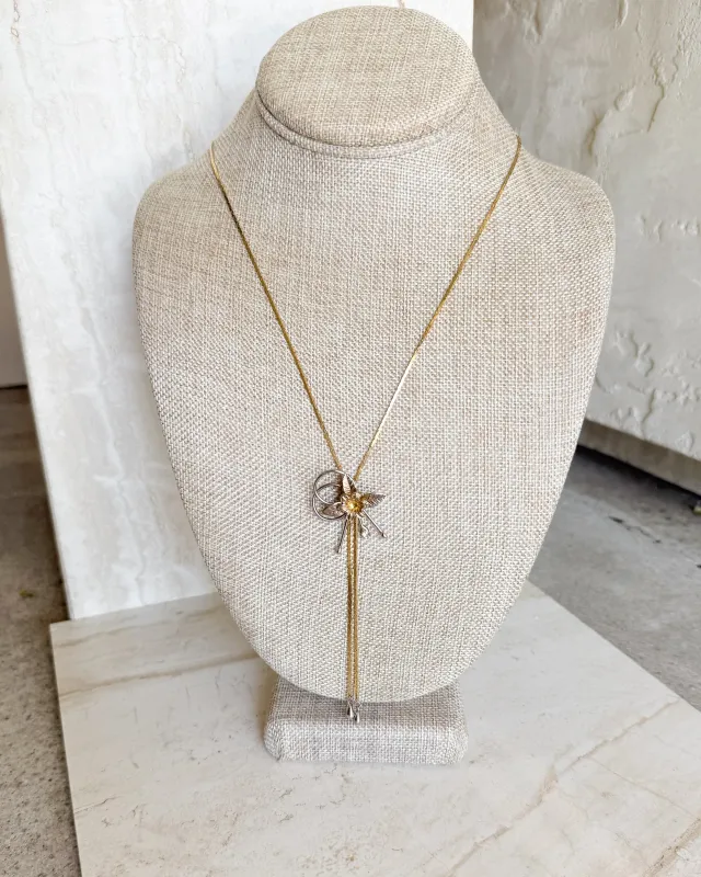 Vintage gold tone floral slide necklace sold by Care Tucker