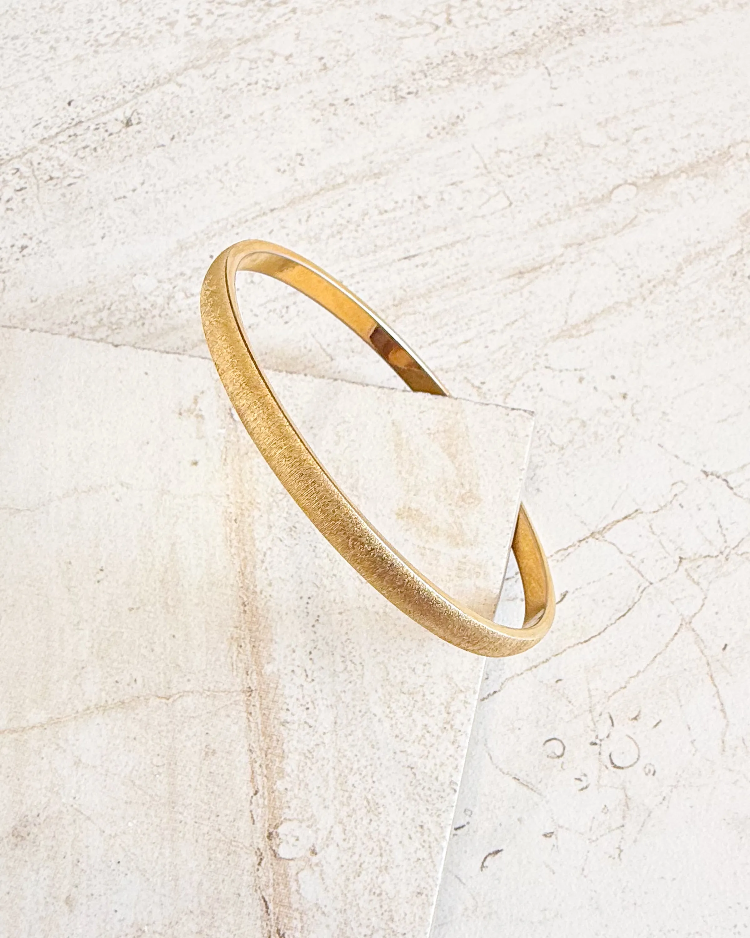 Vintage MONET gold-plated and matt structured bangle sold by Care Tucker