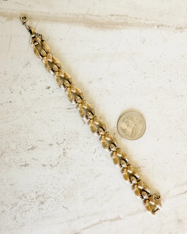 Vintage Monet Gold Knotted Bracelet sold by Care Tucker
