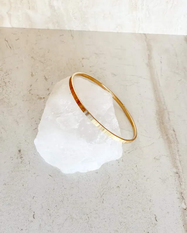 Vintage signed Small Gold Textured Bangle sold by Care Tucker