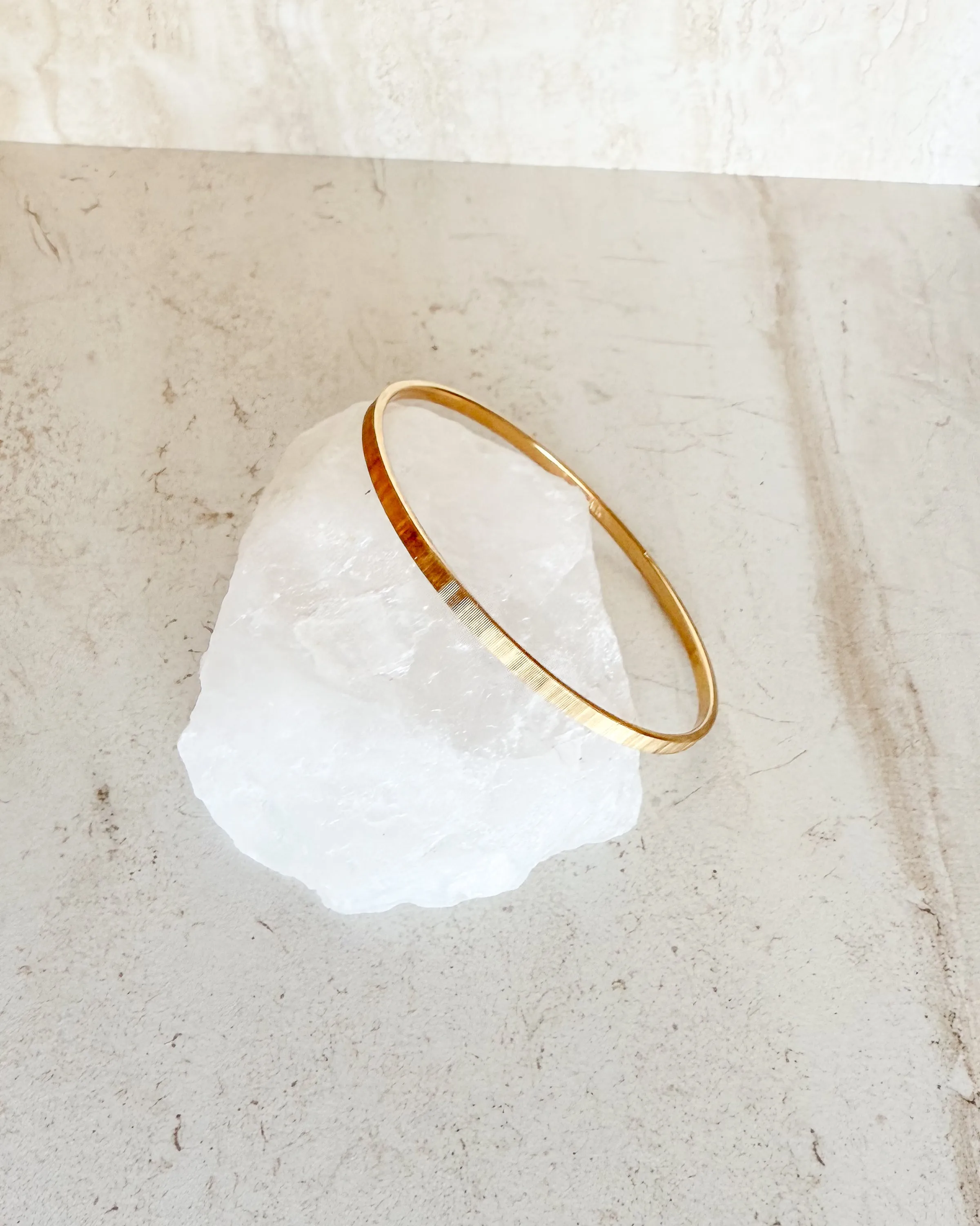 Vintage signed Small Gold Textured Bangle sold by Care Tucker