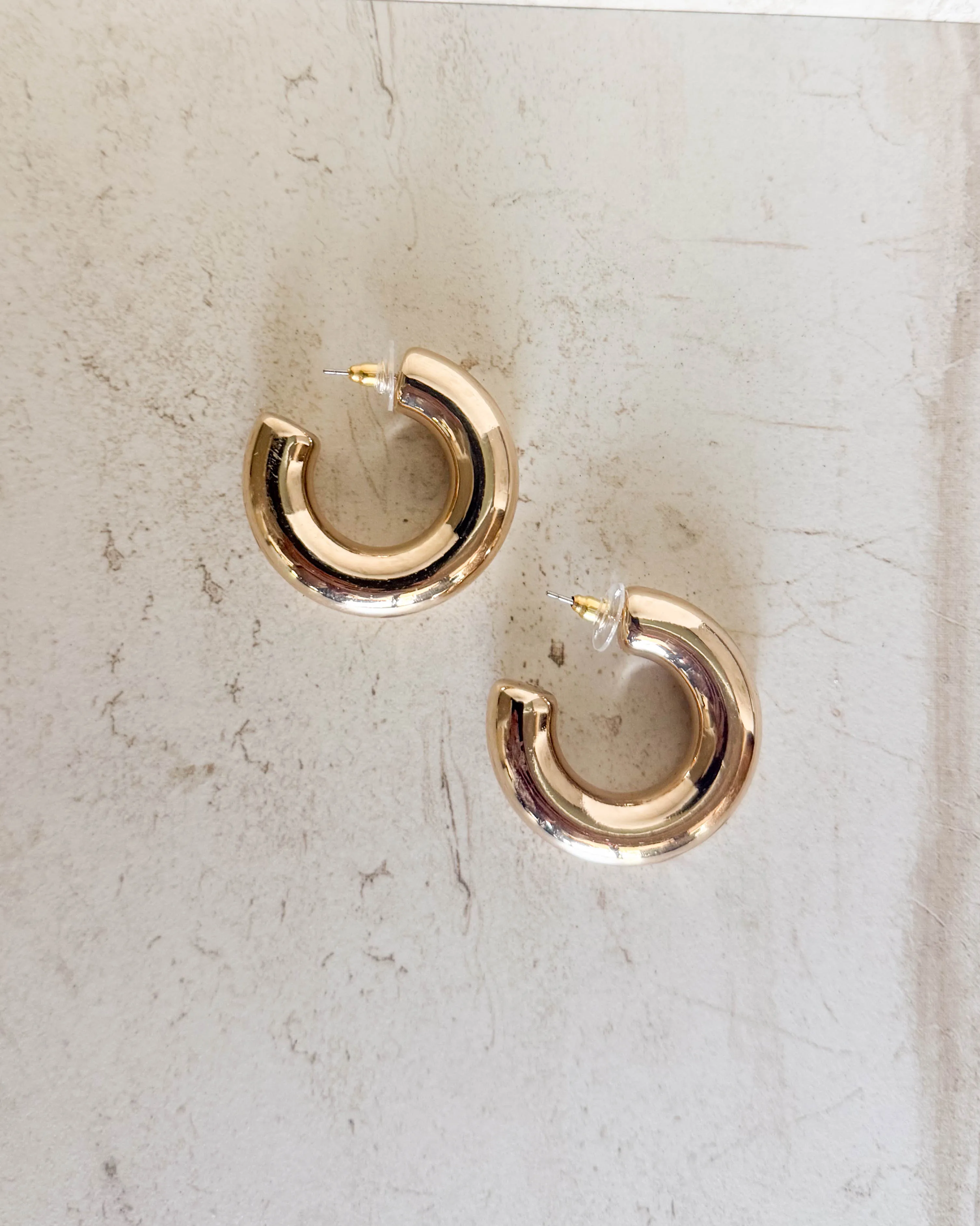 Gold Chunky Hoops sold by Care Tucker