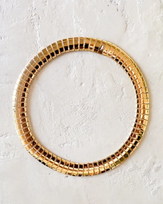 Vintage Monet Gold-Tone Omega Statement Necklace sold by Care Tucker