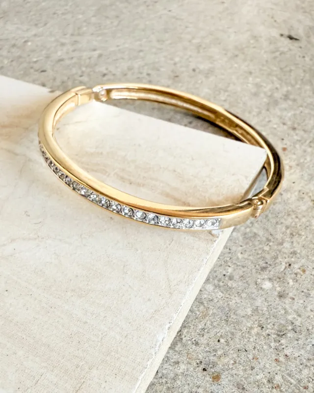 Vintage Signed Gold plated Steel And Shiny Stones Bangle Bracelet sold by Care Tucker