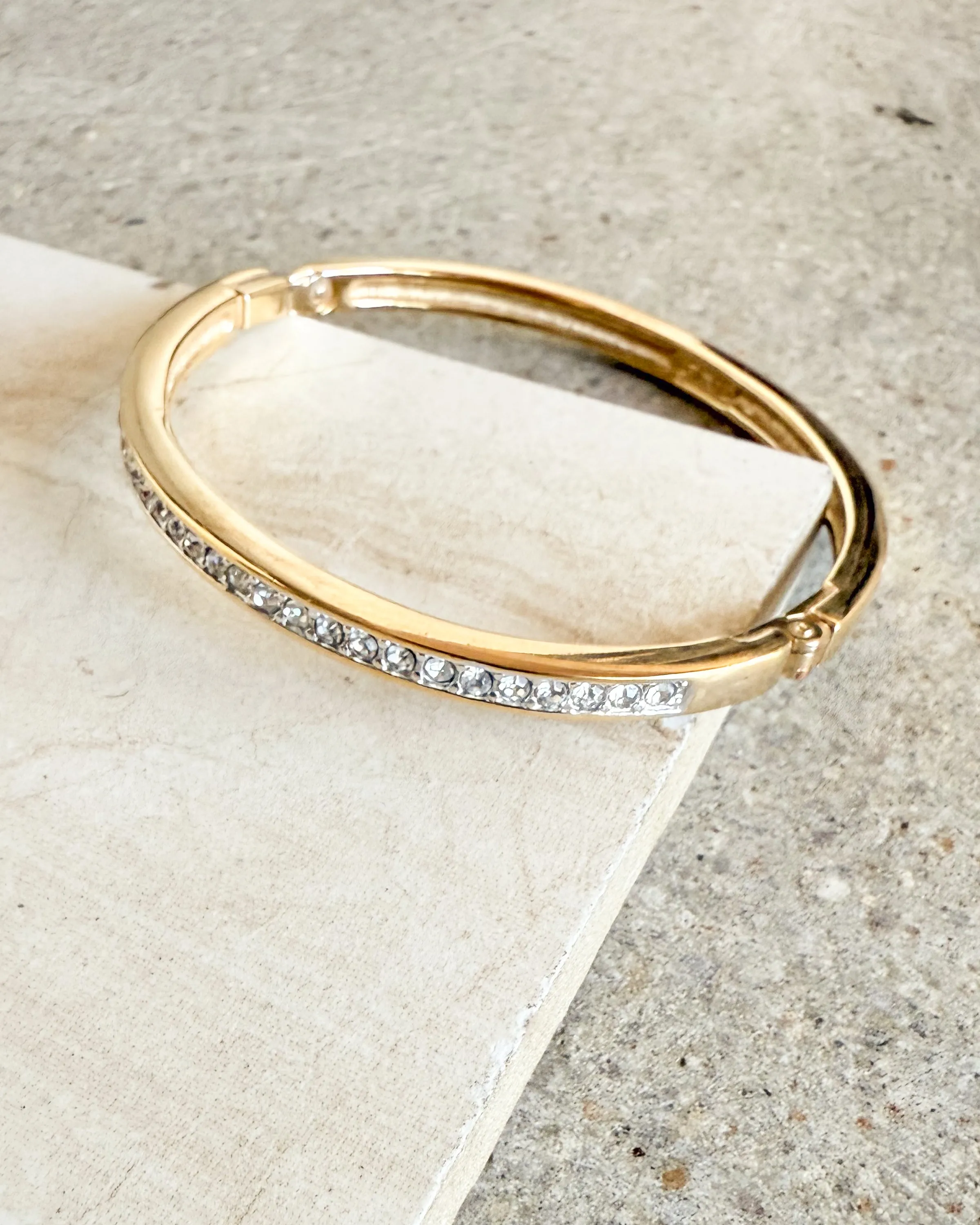 Vintage Signed Gold plated Steel And Shiny Stones Bangle Bracelet sold by Care Tucker