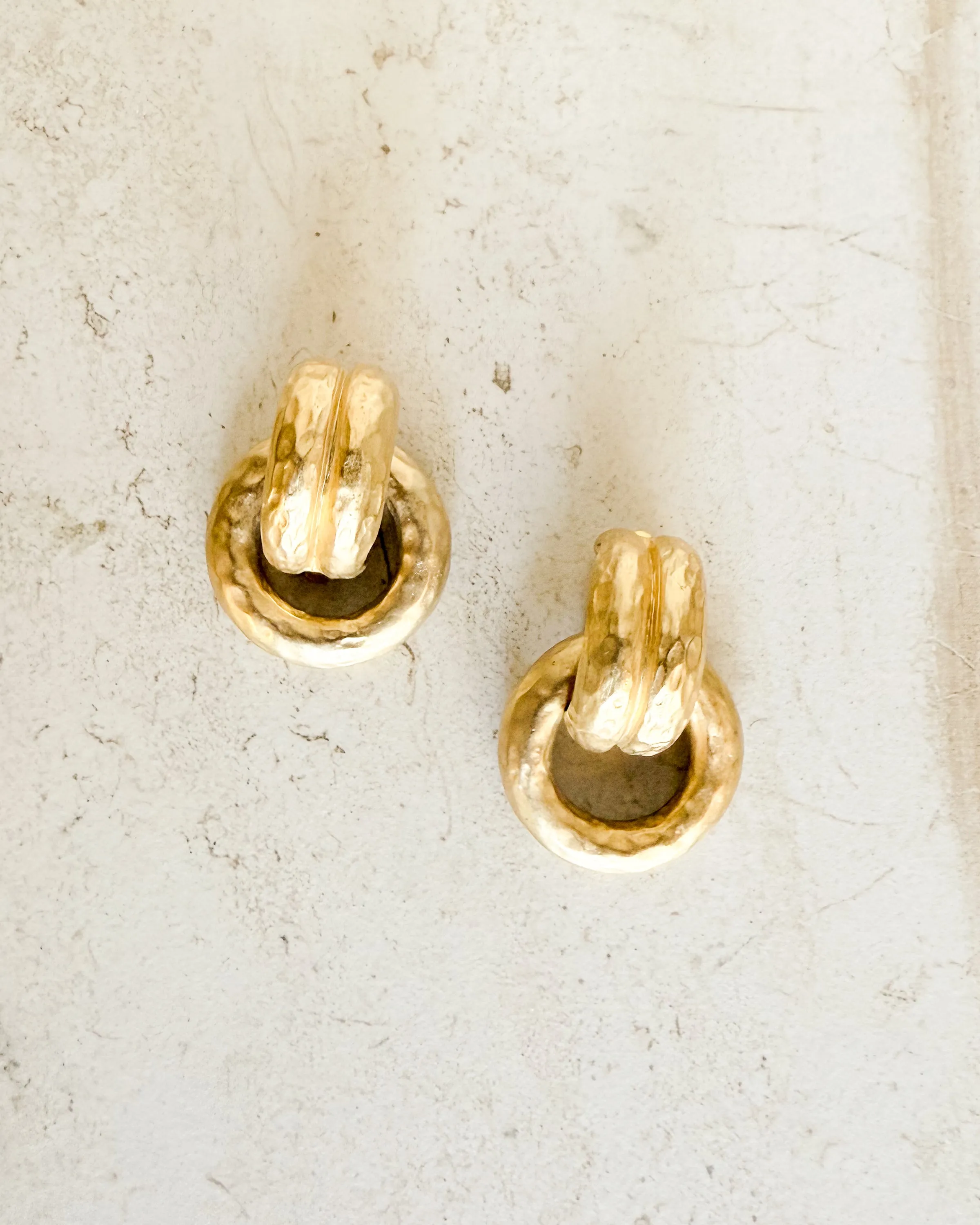 Vintage round hammered clip-on hoops sold by Care Tucker