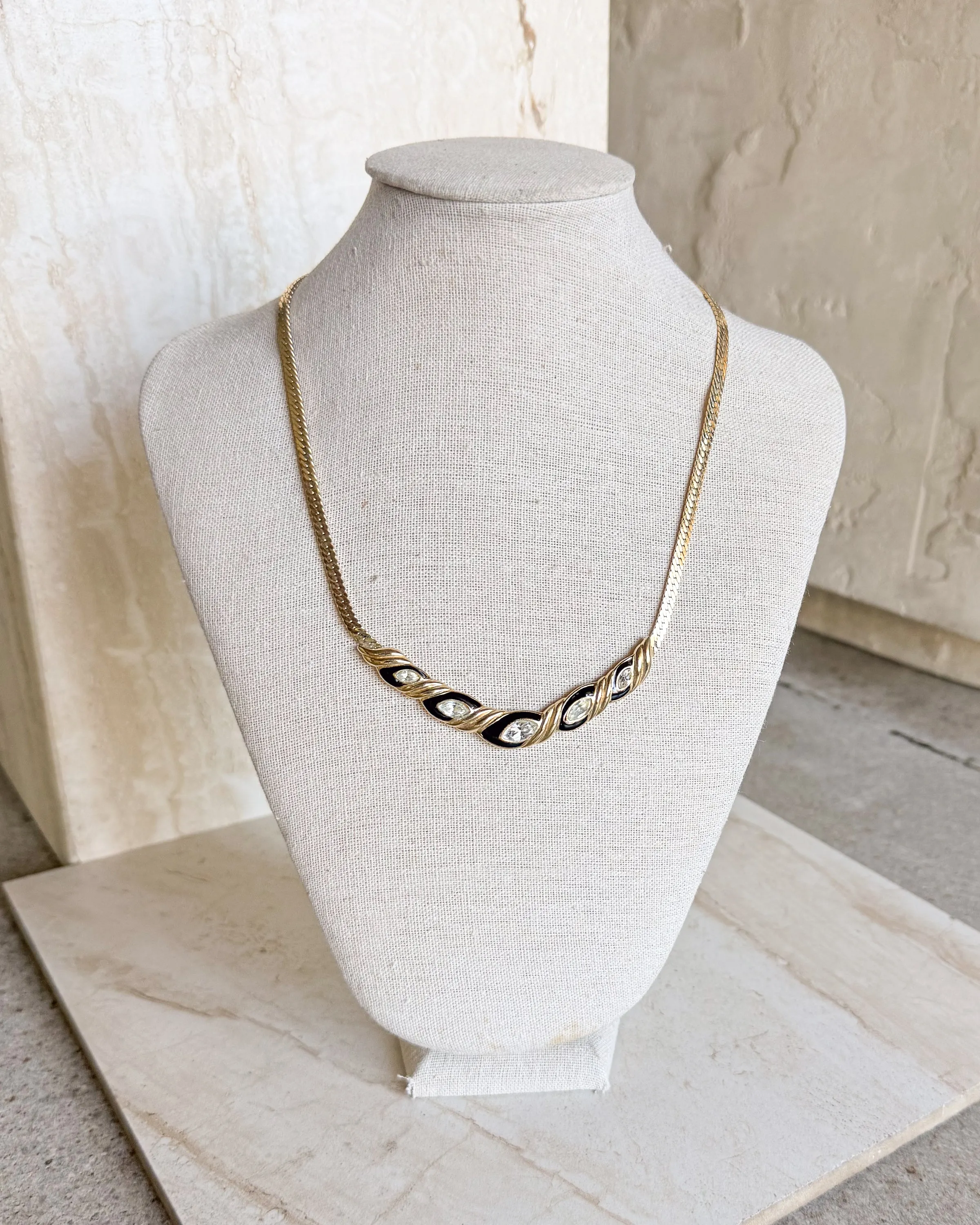 Vintage Signed black enamel, clear rhinestone necklace sold by Care Tucker