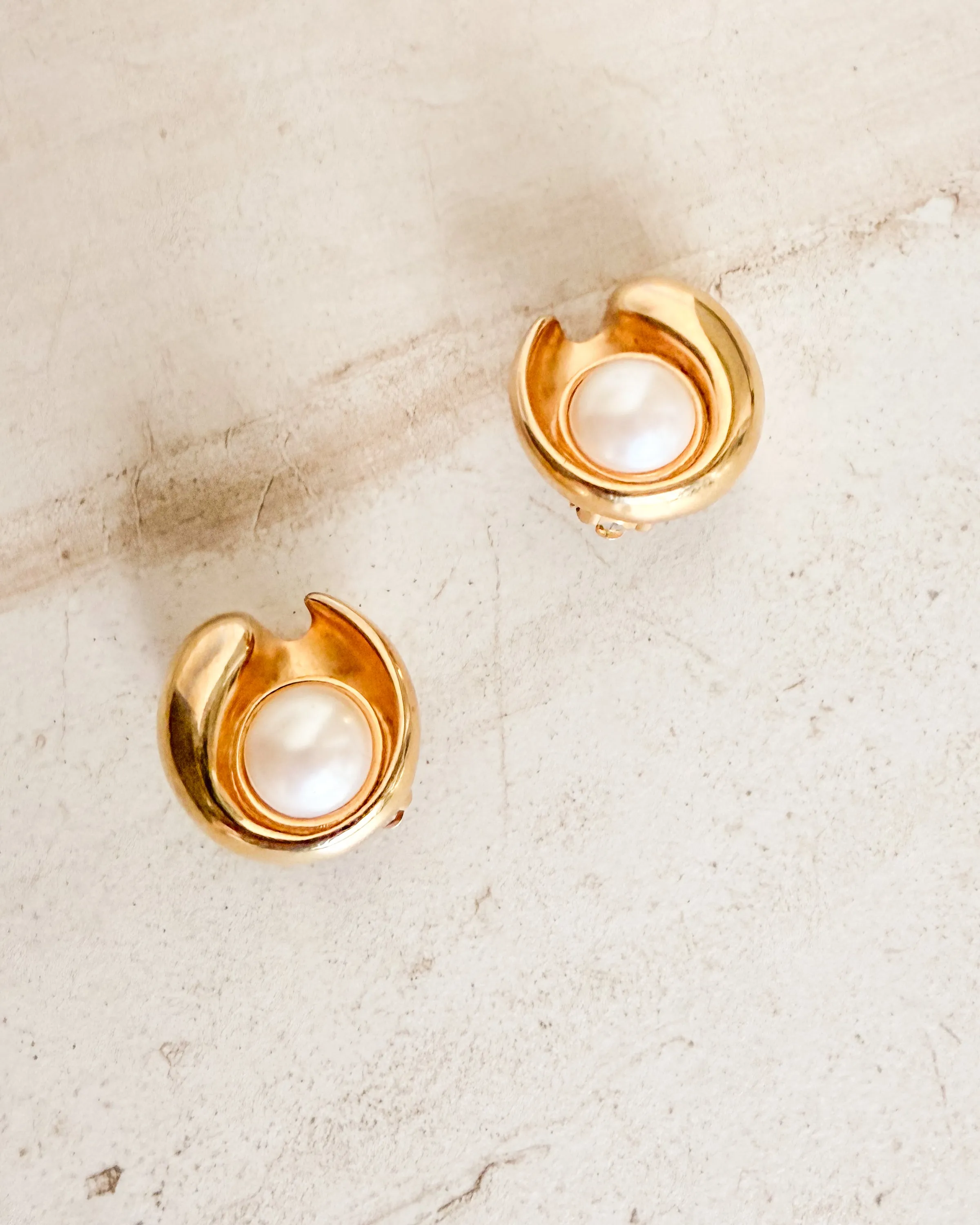 Vintage Signed Polished Gold Tone Swirl Clip On Earrings with Dome Pearl Center sold by Care Tucker