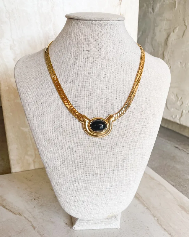 Vintage Signed Gold and Black Oval Stone Herringbone Necklace sold by Care Tucker