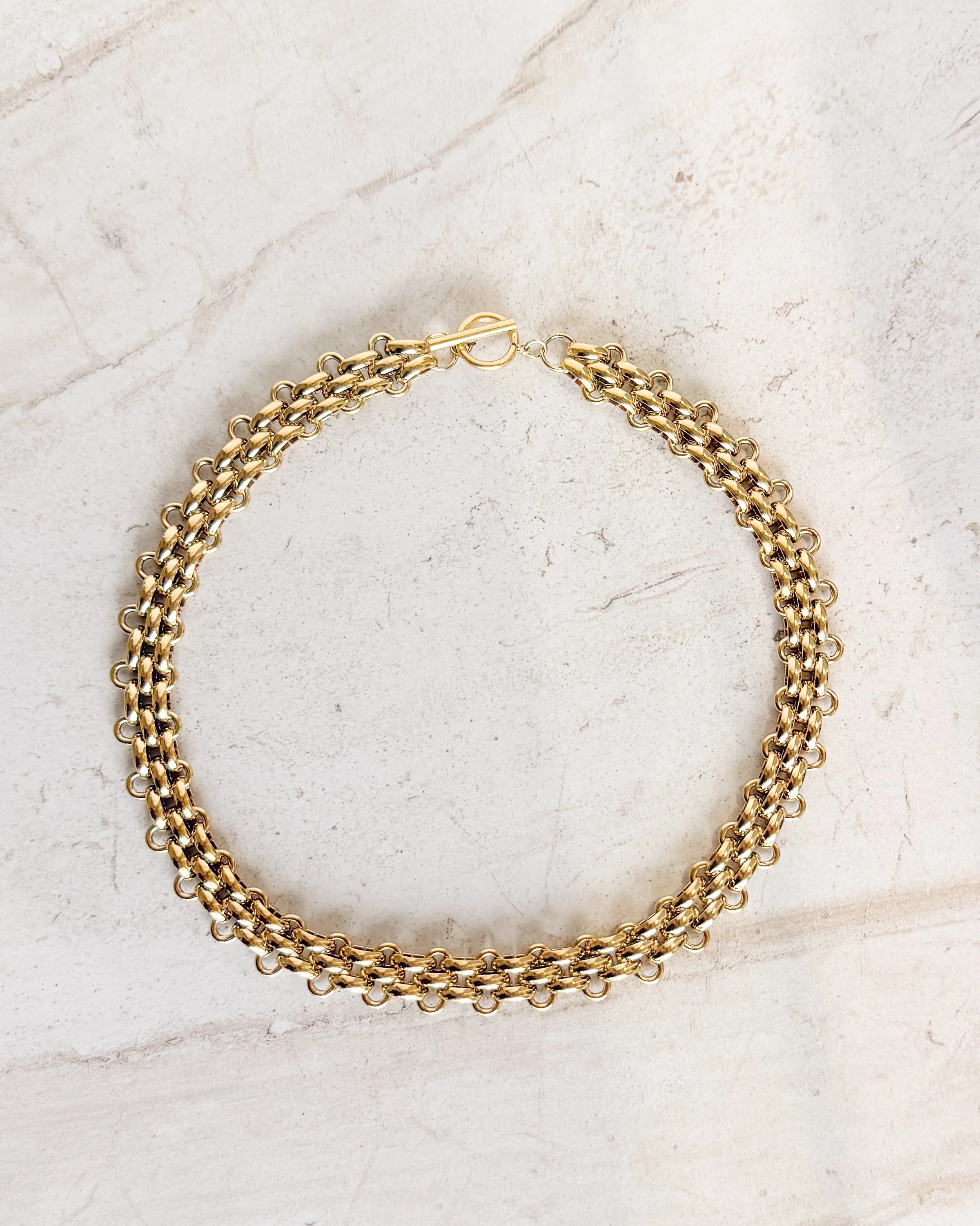 Thick Gold Interlocking Chain Necklace sold by Care Tucker