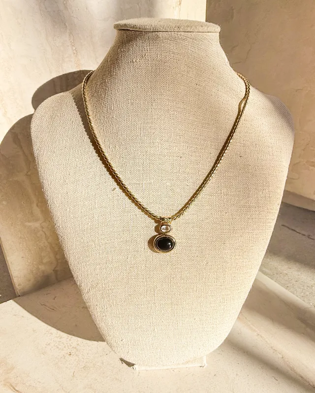 Vintage Swarovski Gold tone Black cabochon pendant necklace sold by Care Tucker