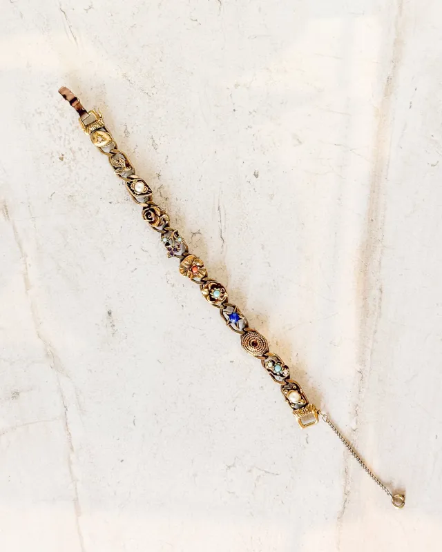 Vintage various shapes and stones slide charm bracelet made by Care Tucker