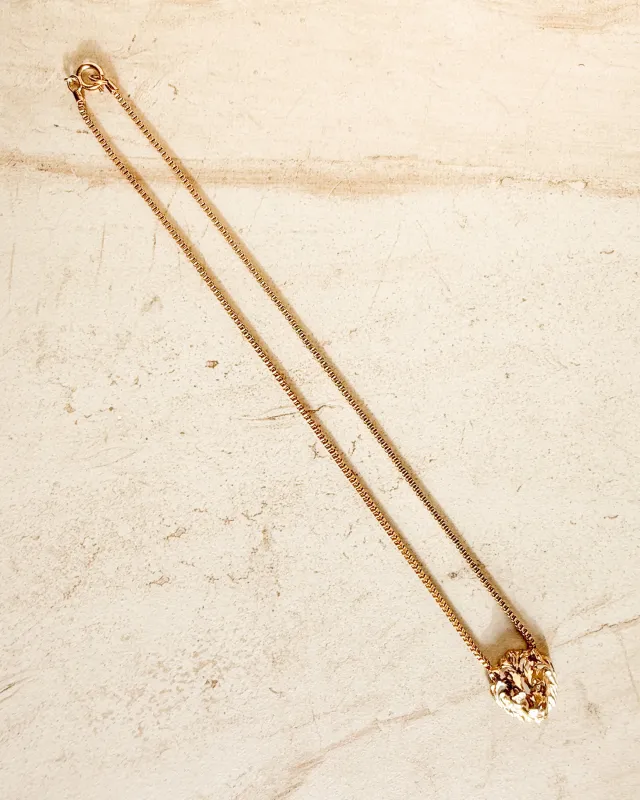 Vintage Lion Head gold necklace sold by Care Tucker