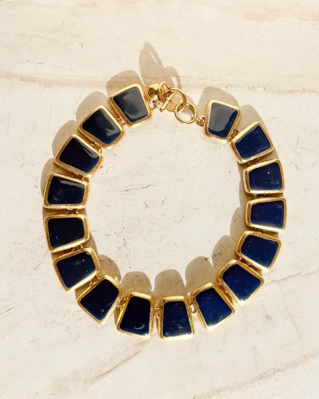 Vintage Designer gold tone and blue enamel wedge Necklace sold by Care Tucker