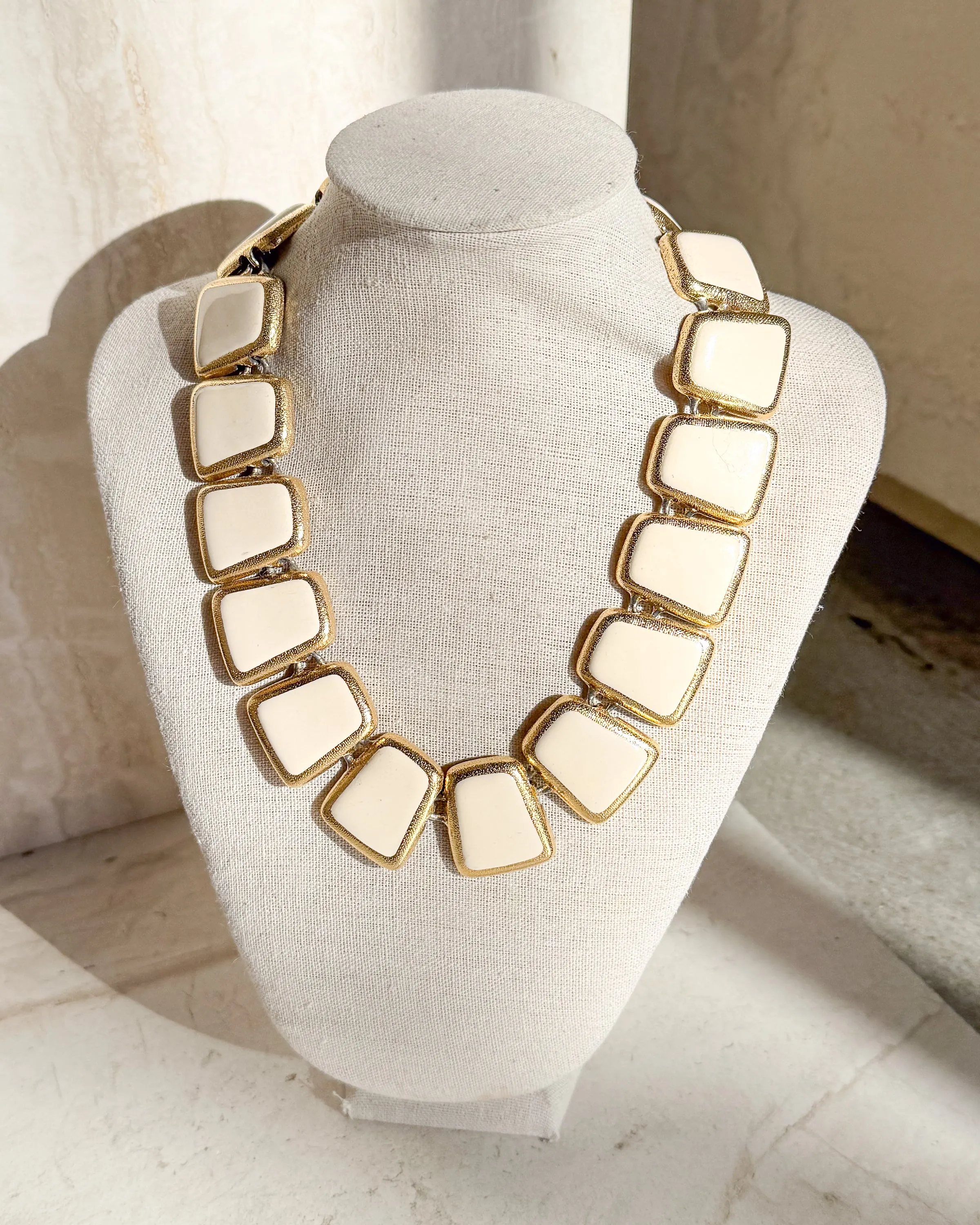 Vintage Designer gold tone and Ivory enamel wedge Necklace sold by Care Tucker