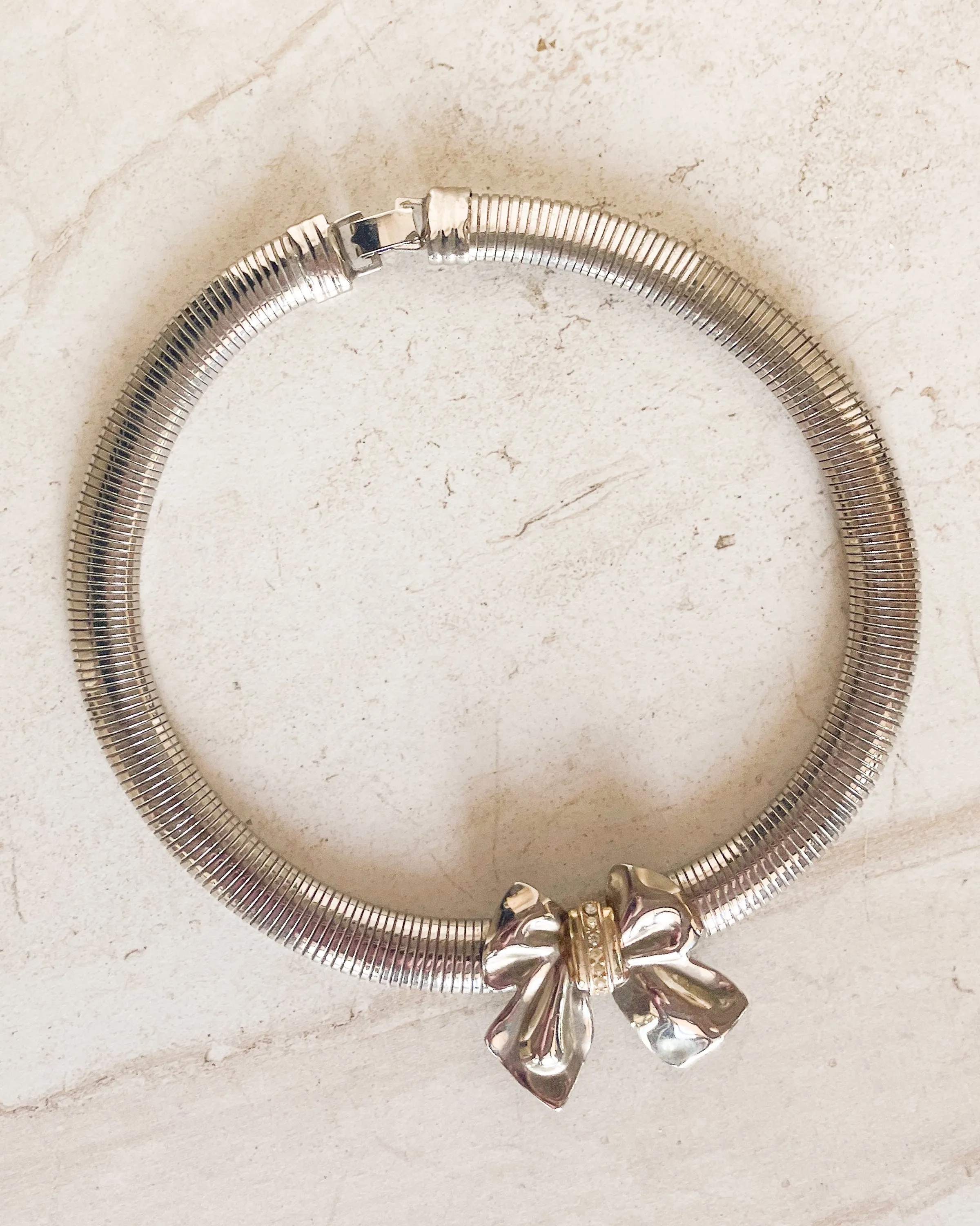 Vintage two tone bow silver snake chain choker sold by Care Tucker