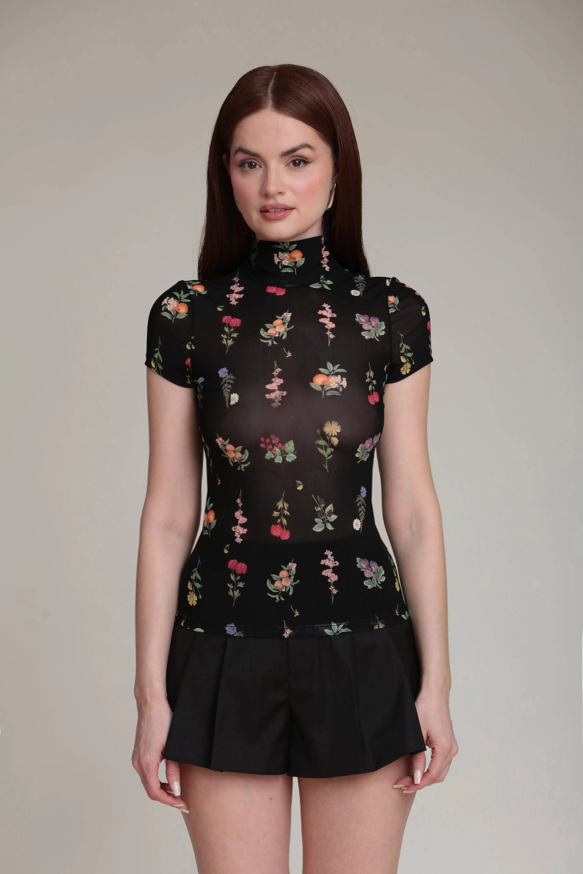Floral Mesh Mock Neck Top (Black Botanical) sold by Care Tucker