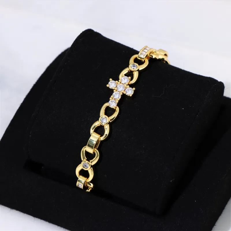 Women's 12mm Cross Bracelet in Gold sold by Ghetluxe