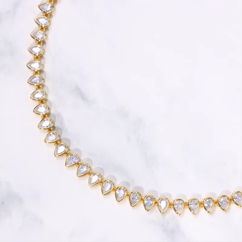 Women's Pear Cut Bezel Tennis Necklace in Gold sold by Ghetluxe