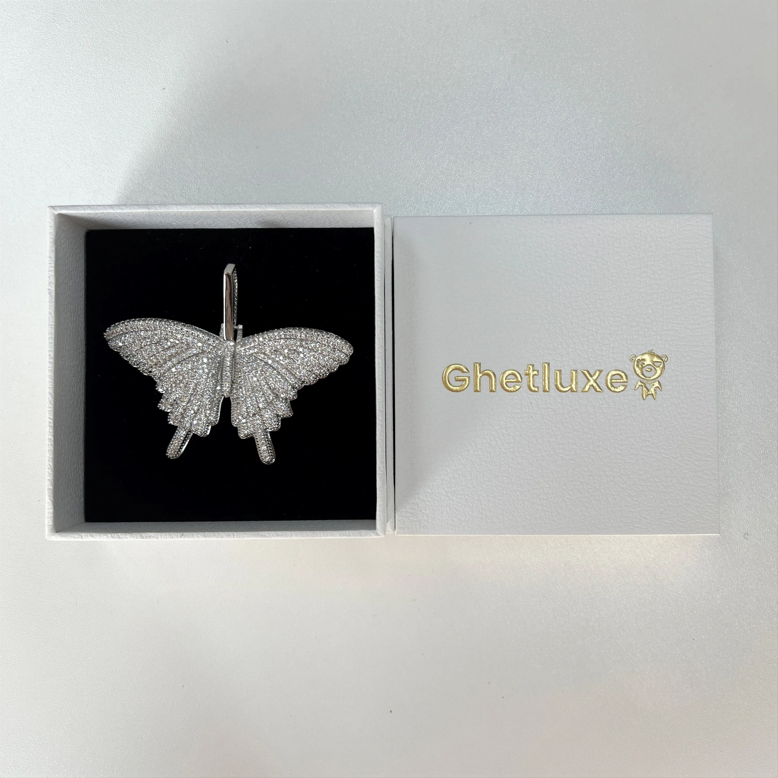 Iced Butterfly Pendant in White Gold sold by Ghetluxe product image thumbnail 3
