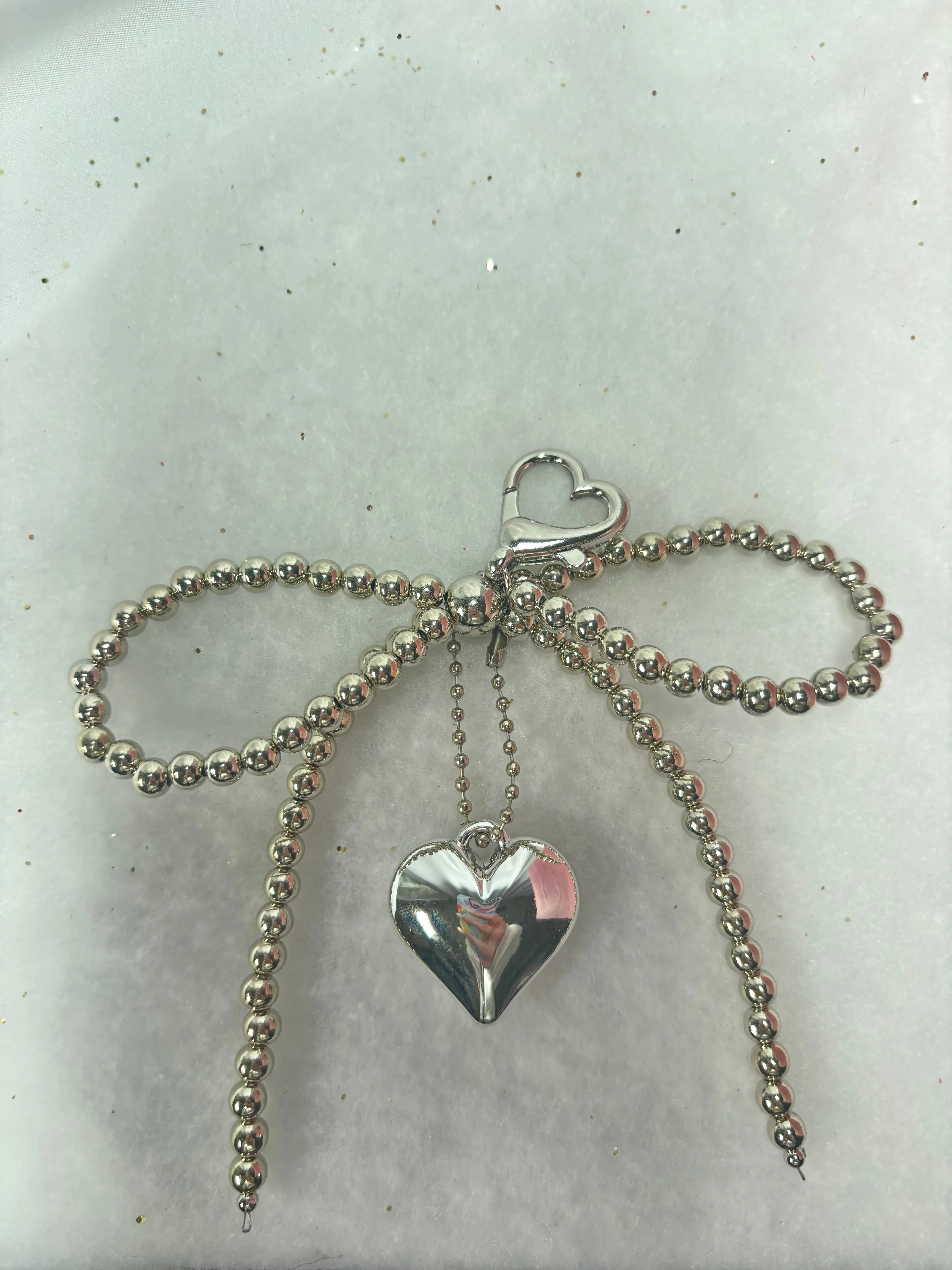 Silver Bow Heart Charm sold by KC Chic Designs