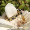 14K Yellow Engraved Sapphire Floral Diamond Wedding Band sold by Kirk Kara