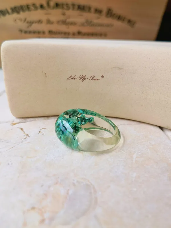 Dried flower resin ring with green flowers sold by Like My Choice