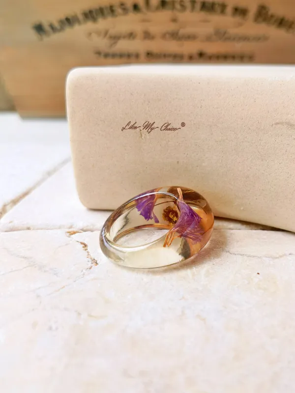 Dried flower resin ring with purple flowers sold by Like My Choice