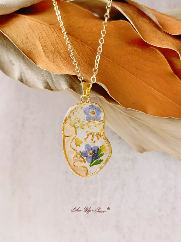 Forget Me Not Resin Pressed Flower Abstract Face Necklace sold by Like My Choice
