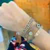 Rainbow Bangle sold by LINDSEY LEIGH JEWELRY