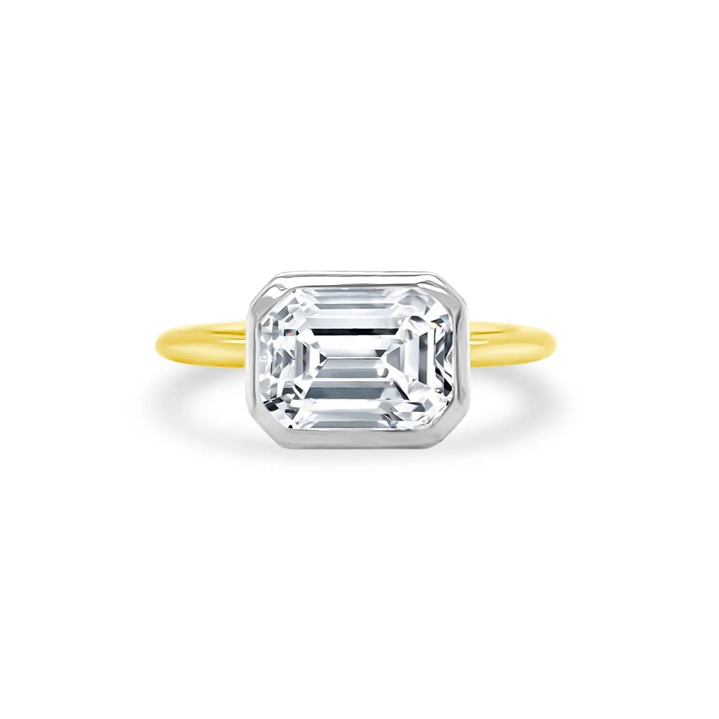 East West Bezel Set Emerald Cut Solitaire sold by LINDSEY LEIGH JEWELRY