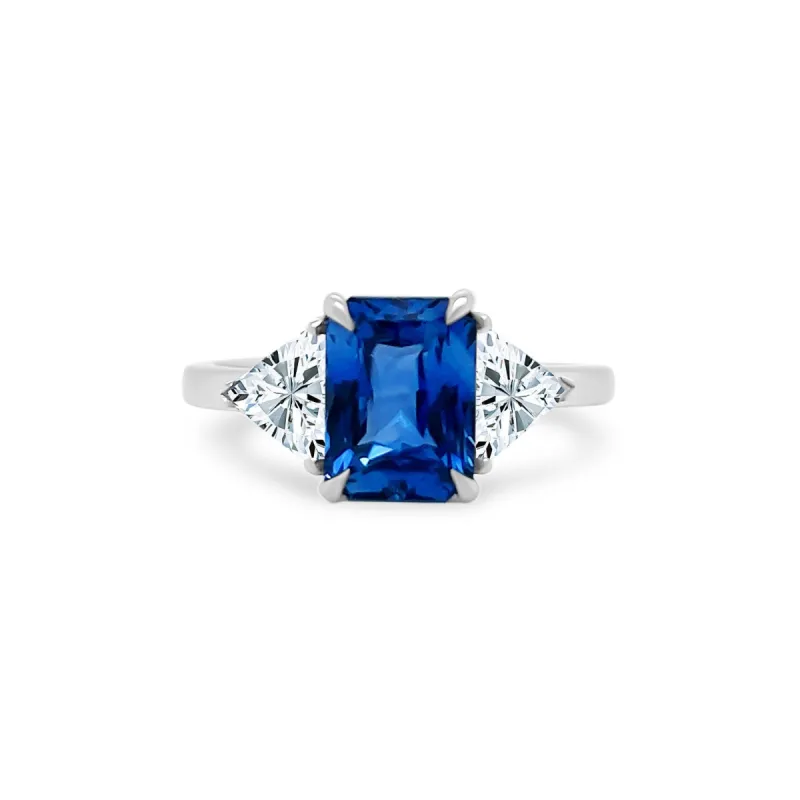 Emerald Cut Sapphire with Trillion Cut Diamond Side Stones sold by LINDSEY LEIGH JEWELRY