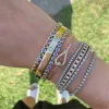 Diamond Bezel Loop Bangle sold by LINDSEY LEIGH JEWELRY